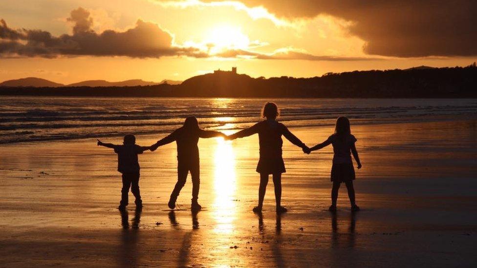 Sunset beach: Alexandra Nash's spectacular view of children holding hands at Black Rock Sands, Gwynedd