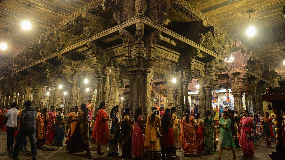 Sri Lankan Hindu devotees offer prayers during Diwali at a temple in Colombo.