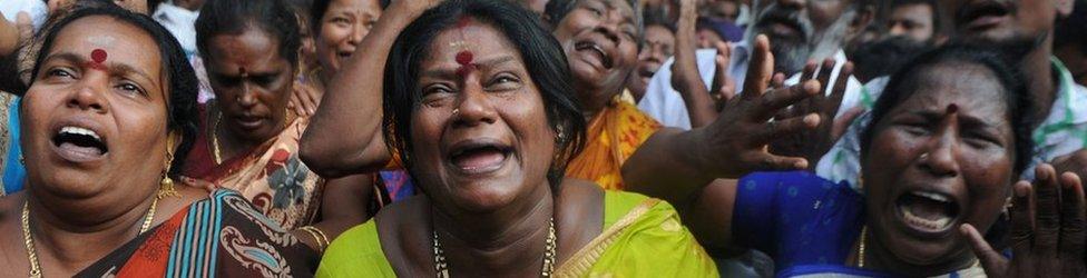 Indian supporters of the Chief Minister of Tamil Nadu Jayalalitha react outside the hospital after false reports that she had died in Chennai