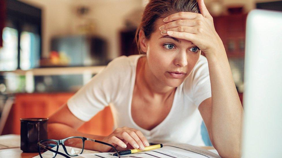 Woman checking bills