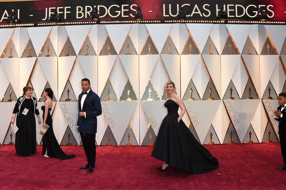 Terrence Howard (centre left) and Kirsten Dunst arrive at the Oscars