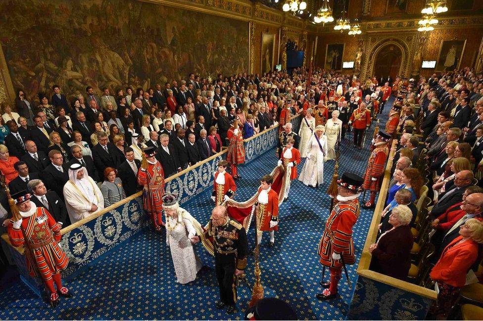 Queen Elizabeth II and the Duke of Edinburgh proceed through the Royal Gallery ahead of the State Opening of Parliament, 2016