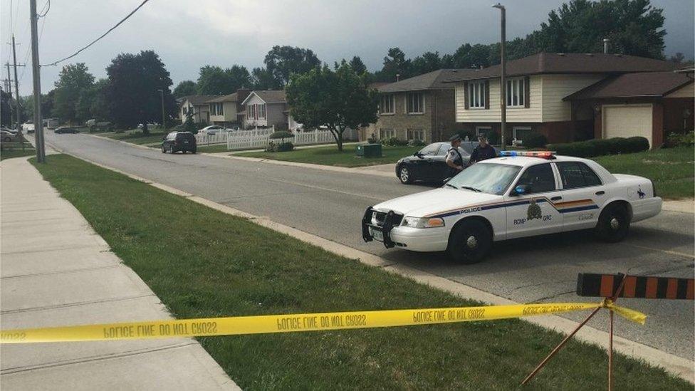 Royal Canadian Mounted Police (RCMP) block the entrance to Park Street as they investigate the residence of Aaron Driver, a Canadian man killed by police on Wednesday