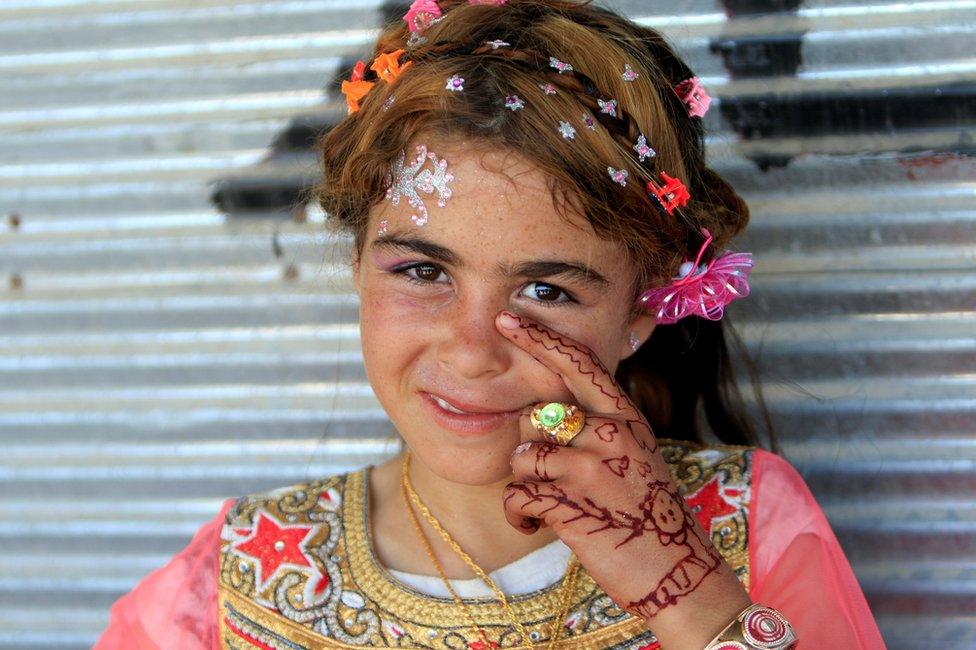 Iraqi girl celebrates Eid al-Fitr in Mosul, 25 June