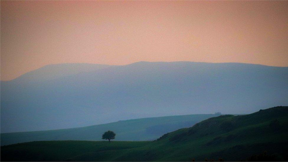 Sunset over Moel Unben looking towards Llanfair Talhaiarn, near Abergele, Conwy county