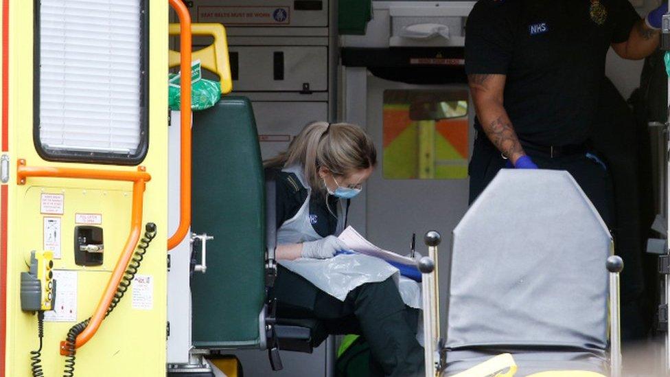 Paramedic wearing protective apron