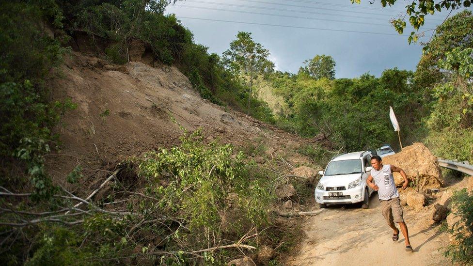 A landslide on a road outside Palu, 29 September