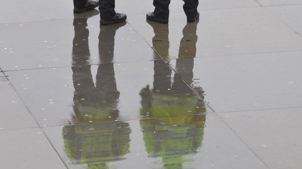 reflection of police in water