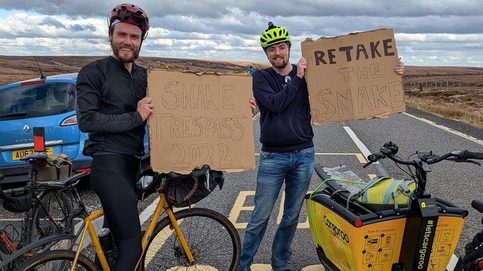 Protest signs on the pass