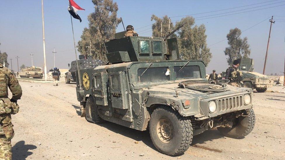 damaged Humvee