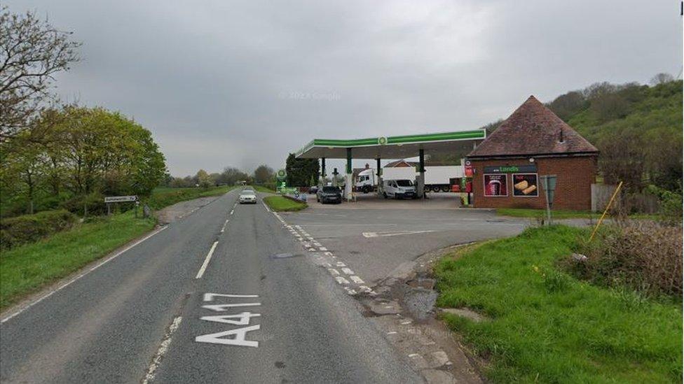 A road with a gas station to one side