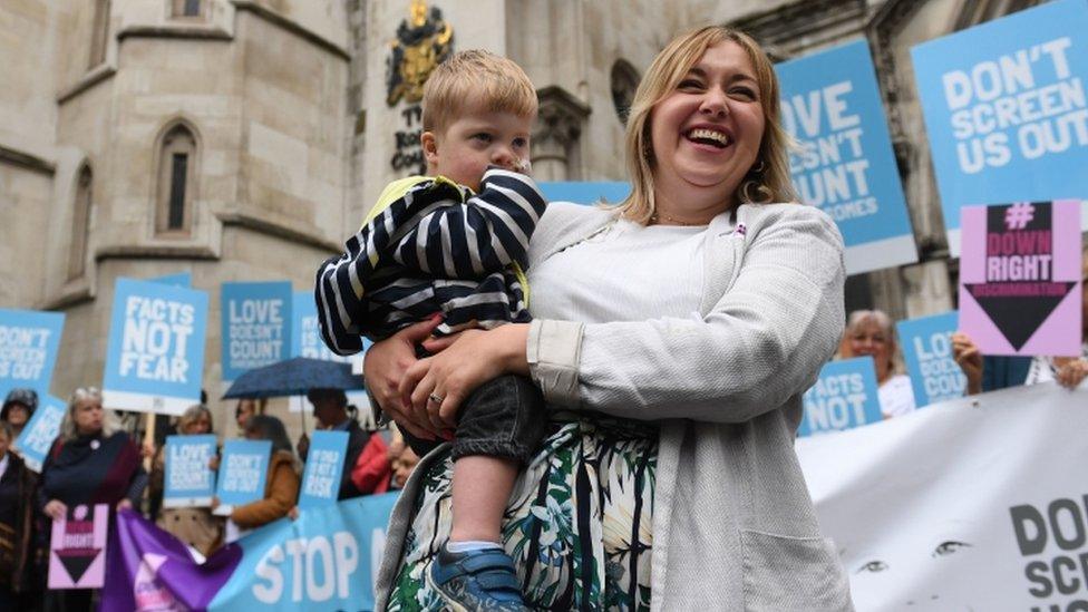 Maire Lea-Wilson, 33, and son Aidan, who has Down's syndrome, outside the Royal Courts Of Justice