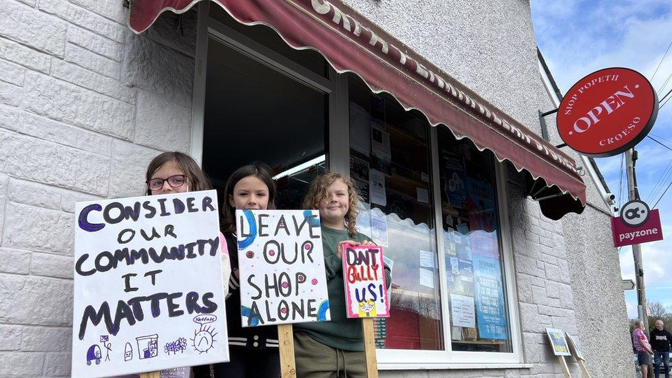 Kids protesting outside shop