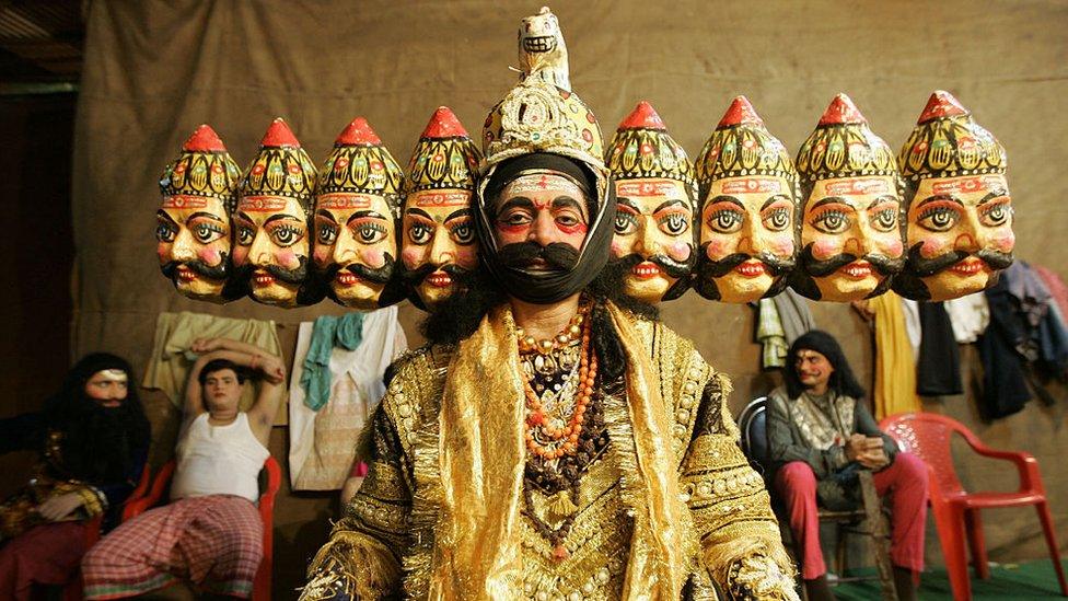 An artist dressed up as th 10 faced Ravana from the mythological Ramayana at Shivaji Park for a Ram Lila show on the occasion of Dassera.