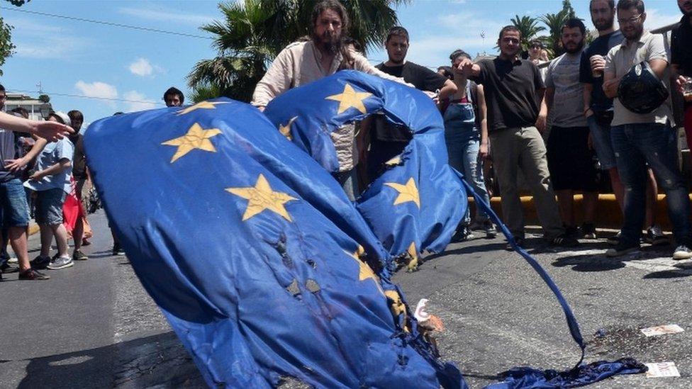 Leftist protesters burn flag in Athens (2 July)