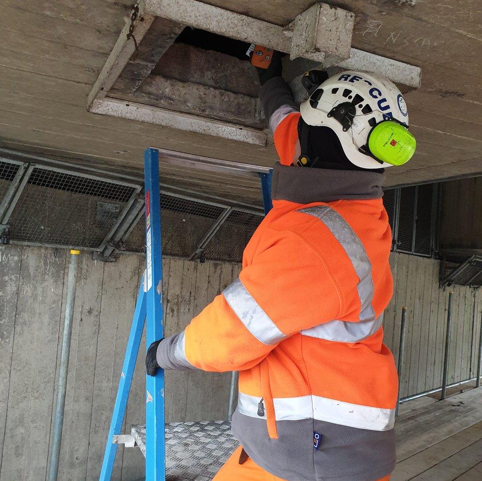 A Highways England worker on the bridge