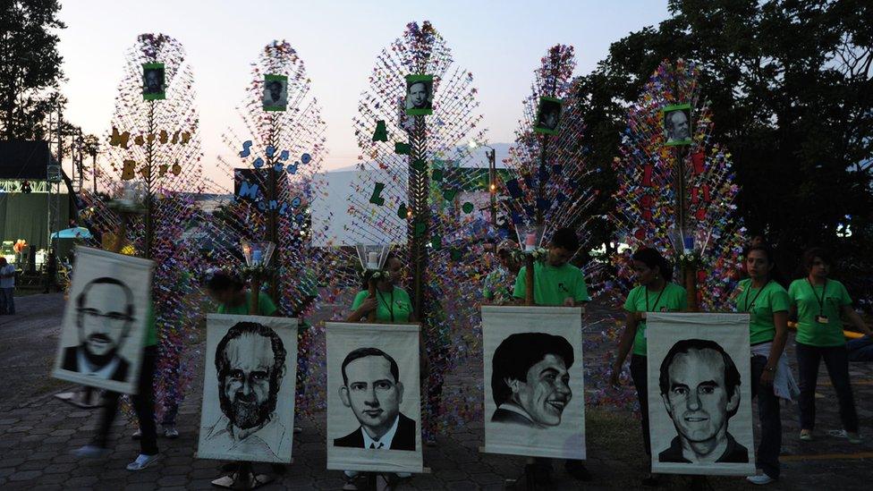 Catholic faithful participate in a procession to commemorate the 26th anniversary, of the murder of Father Ignacio Ellacuria, and five Jesuits priests and two employees, at the Central American University in San Salvador on November 14, 2015