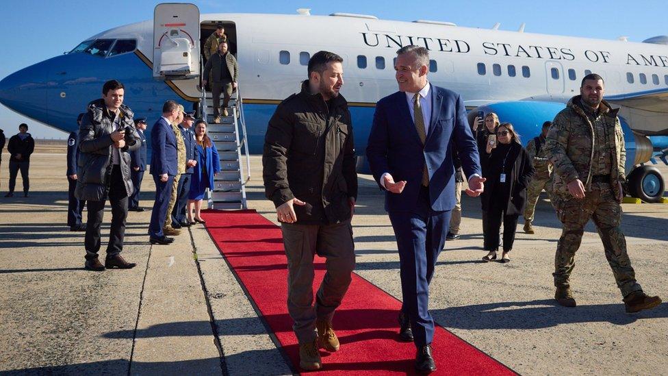 Ukraine's President Volodymyr Zelensky walks with Chief of Protocol of the United States Rufus Gifford as he arrives in Washington