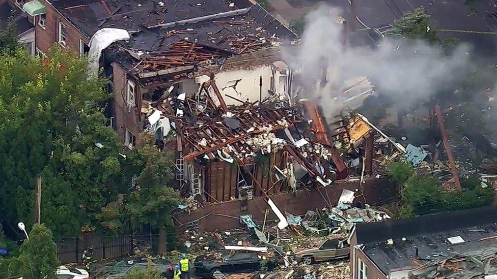 In this frame from video provided by WABC-TV, smoke rises from a house that exploded in the Bronx borough of New York on Tuesday, Sept. 27, 2016