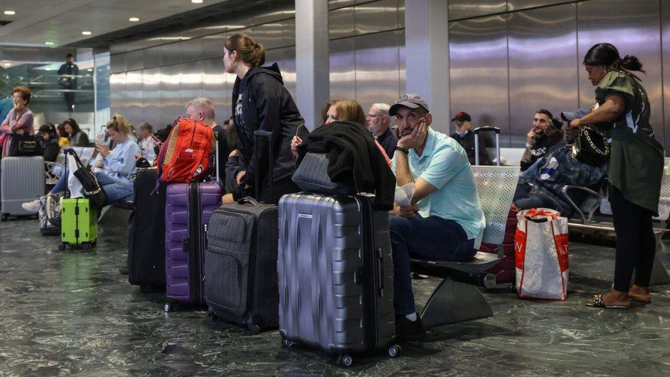 Travellers wait for trains at Euston Station during June's RMT strikes