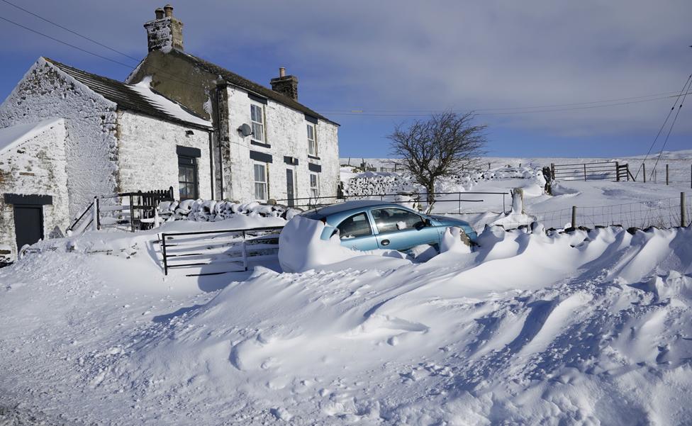 Drifting snow covers a car in Harwood in County Durham, on 8 February 2021