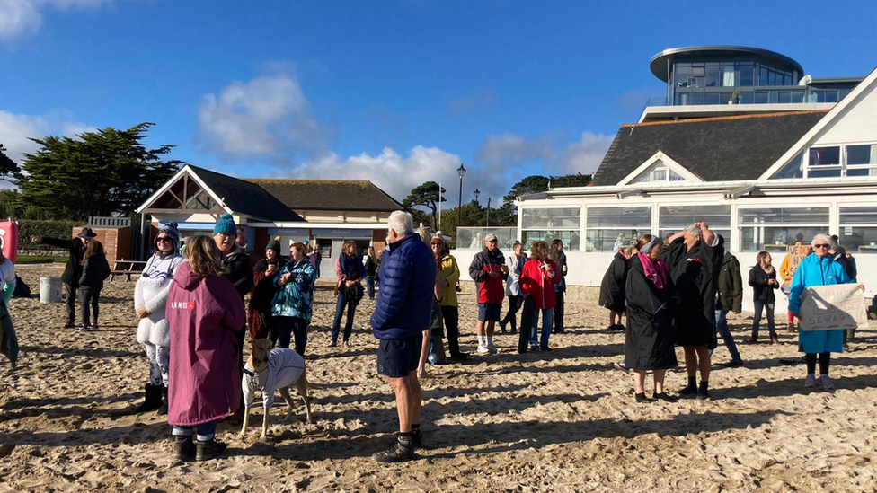 Protestors on Gyllyngvase Beach