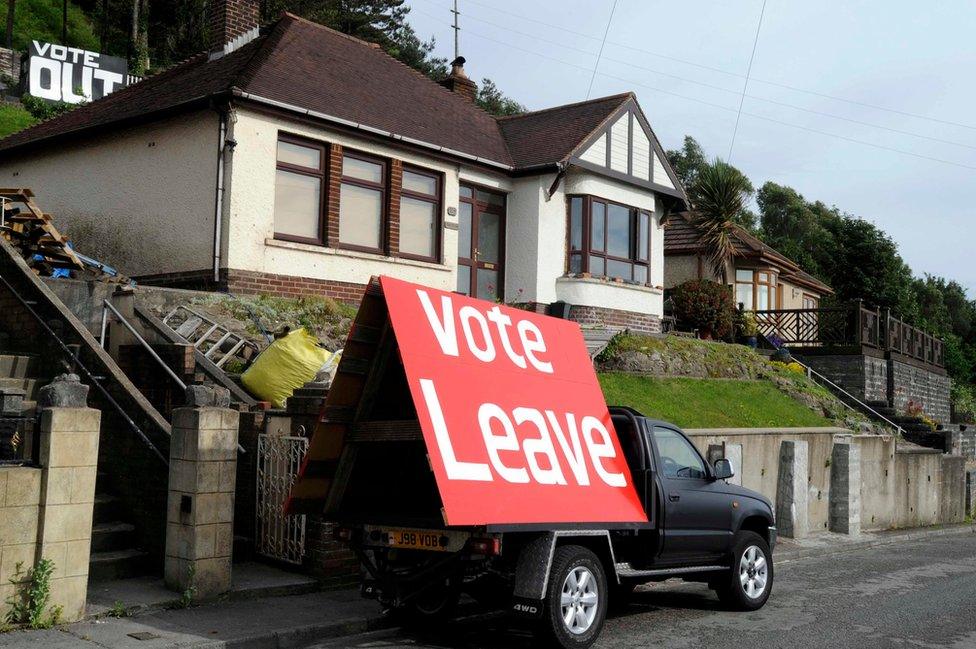 A sign is displayed opposite the M4 near Tata Steel works, on the day of the EU referendum, in Port Talbot in Wales