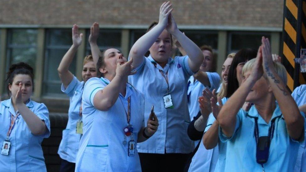 Staff join in the applause at the Freeman Hospital in Newcastle upon Tyne to salute local heroes during Thursday"s nationwide Clap for Carers initiative to recognise and support NHS workers and carers fighting the coronavirus pandemic.