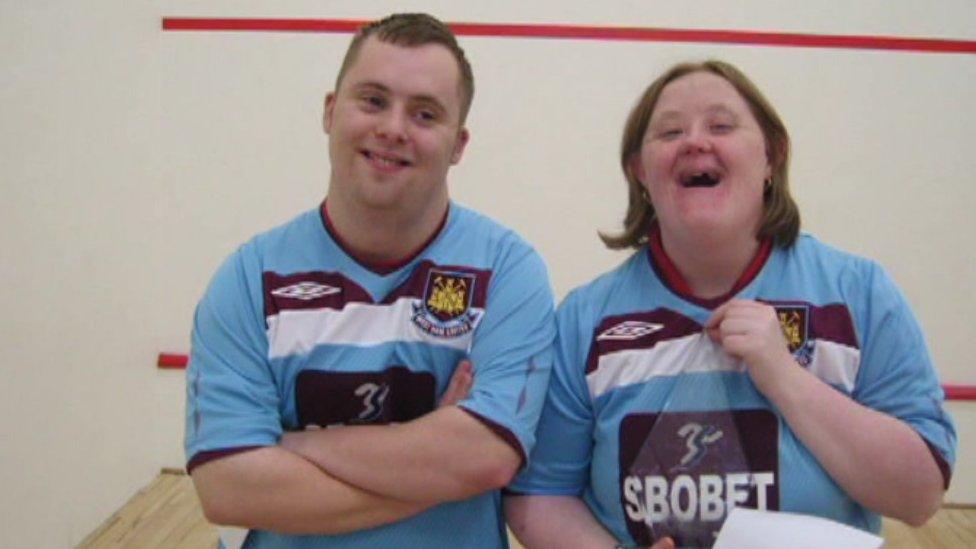 Alison Williams and Michael Gallagher in sports tops at a sports centre