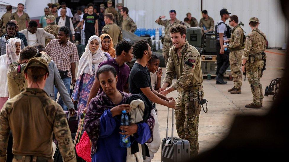 British nationals board a plane during their evacuation