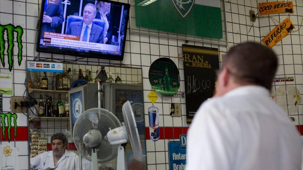 Man watches the Brazilian Senate session that is expected to culminate in a vote on whether to impeach President Dilma Rousseff, at a local bar in Rio de Janeiro on 11 May