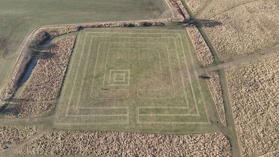 A drone shot of the outline of a Celtic temple and Roman theatre at Gosbecks Archaeological Park