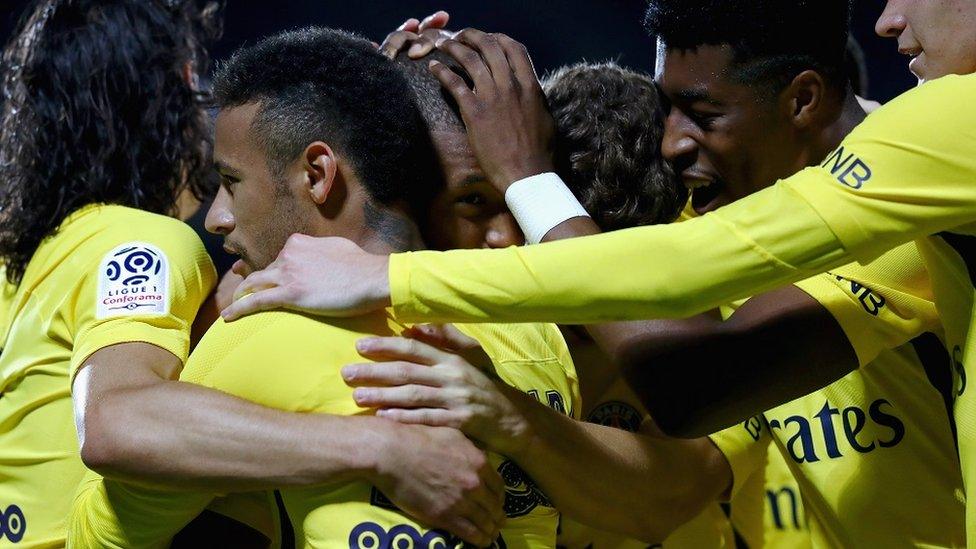 Kylian Mbappe of PSG celebrates scoring his teams second goal of the game with team mates during the Ligue 1 match between Metz and PSG on Friday