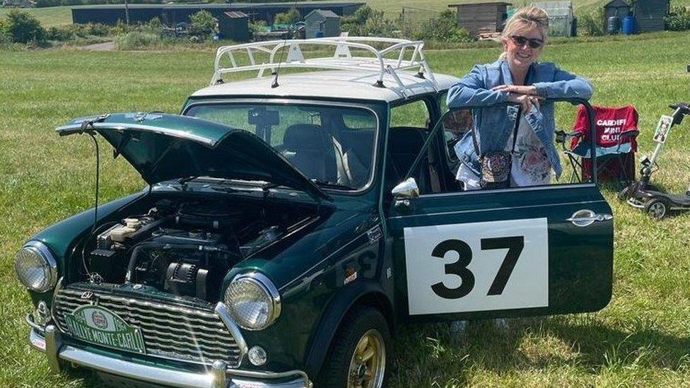 Lisa with her classic Mini car