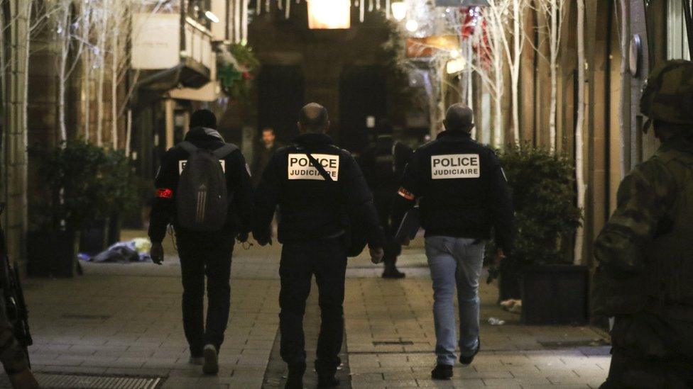 French police officers inspect the deadly shooting site at the Christmas market in Strasbourg, France, 11 December 2018