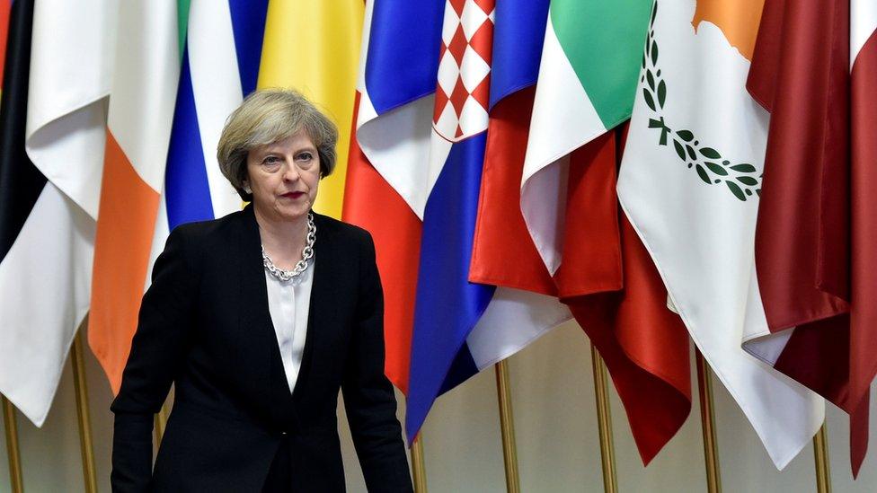 Theresa May/flags, Brussels, 15 Dec 16