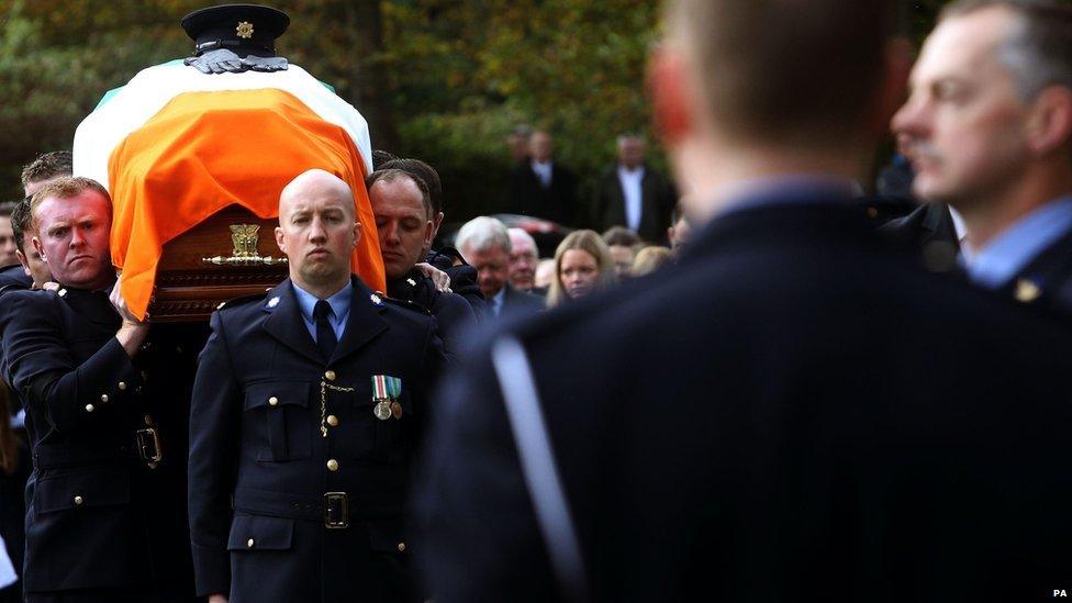 Uniformed officers formed a guard of honour as Anthony Golden's coffin was carried into the church