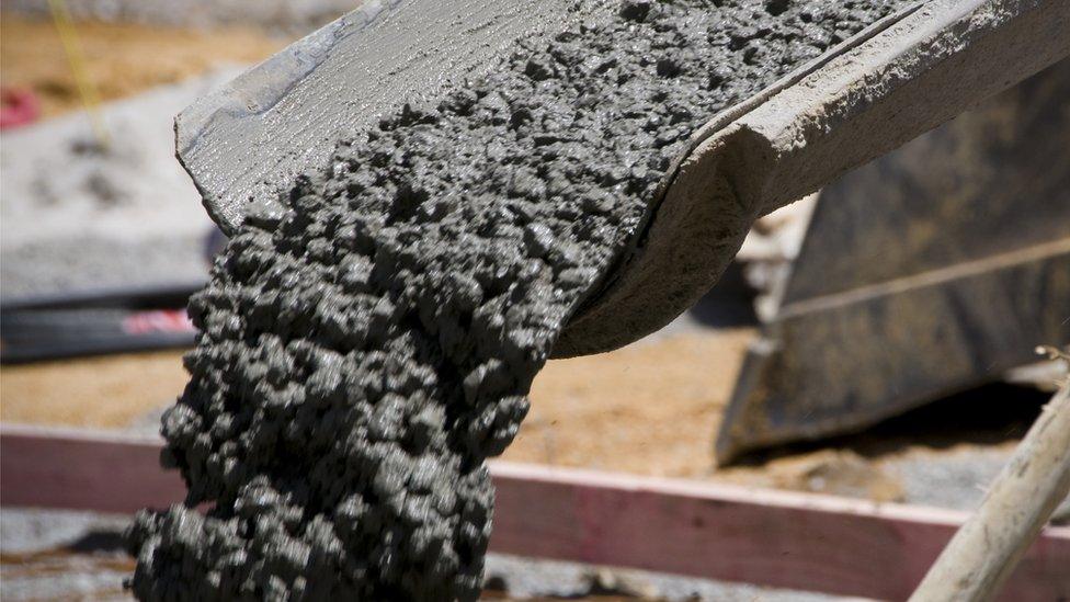 Concrete pours down a tube