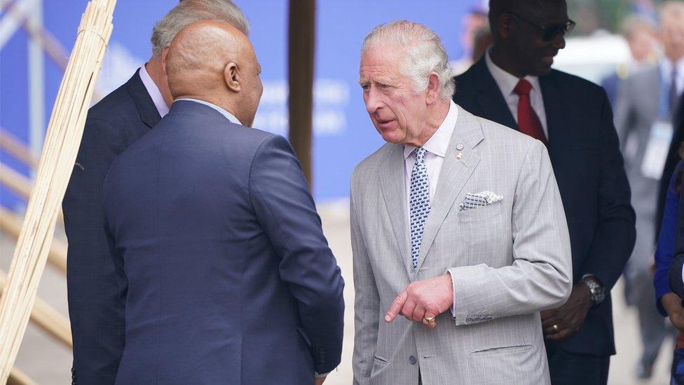 The Prince of Wales speaks to people on his visit to Rwanda