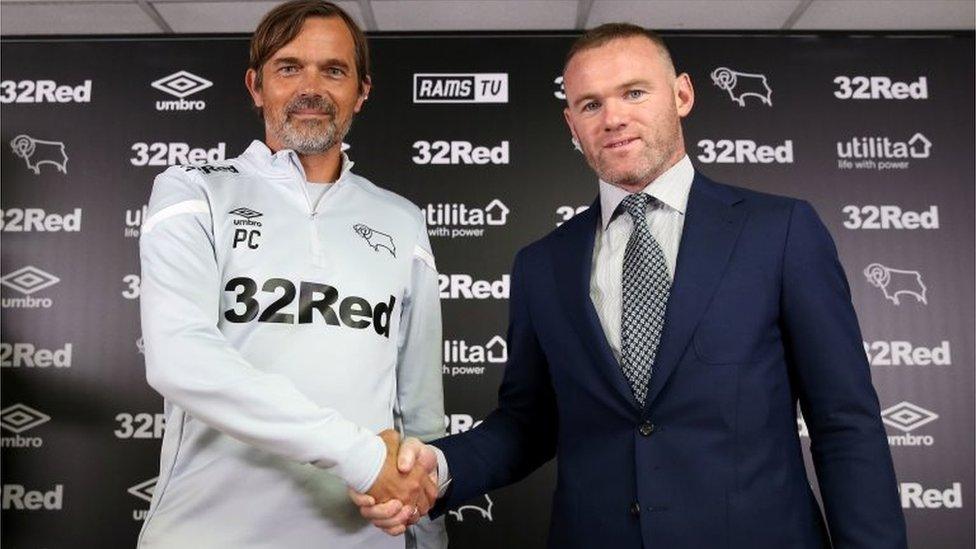 Wayne-Rooney-shakes-hands-with-Derby-County-manager-Phillip-Cocu.