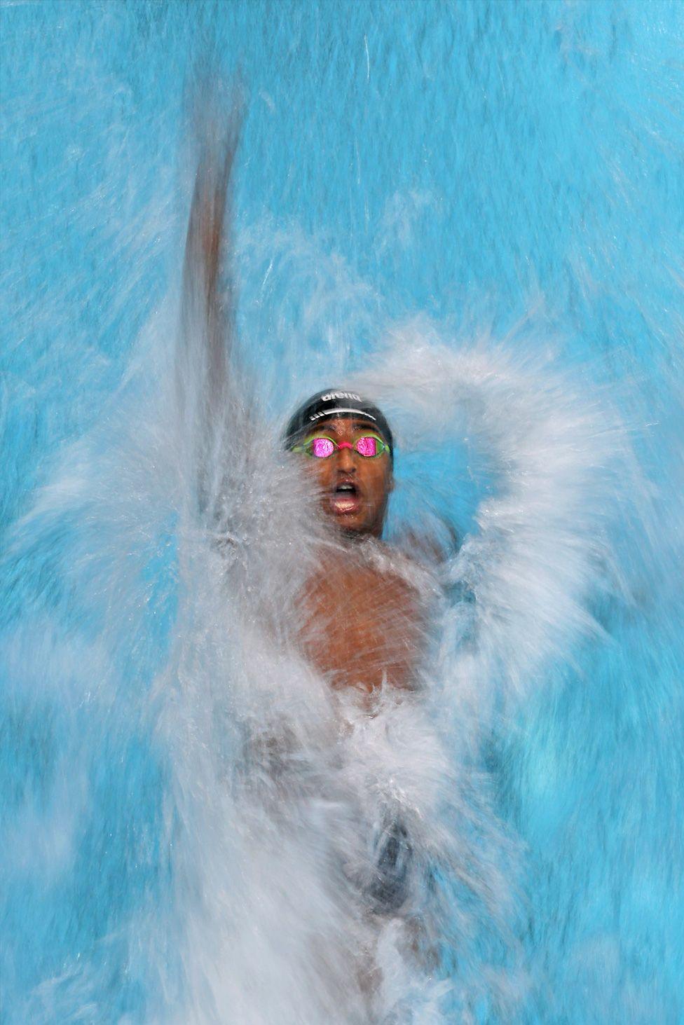 Miles Blackson-Dunbar competes in the Men's 50m Backstroke Heats on day three of the Toyota National Championships at Indiana University Natatorium. Photo by Maddie Meyer