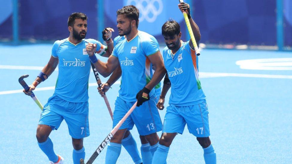 Harmanpreet Singh celebrates scoring the first goal with Sumit and Varun Kumar during the Men's Semifinal match between India and Belgium.