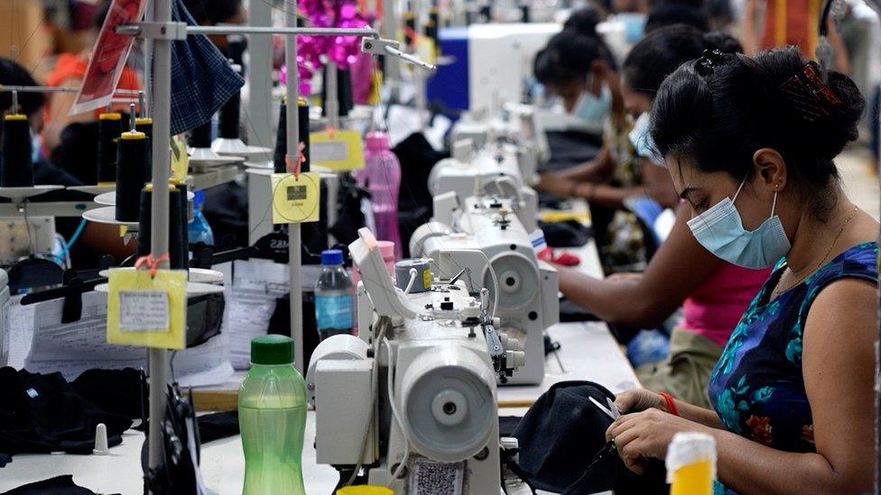 Workers at the Kolonna Manufacturing garment factory.