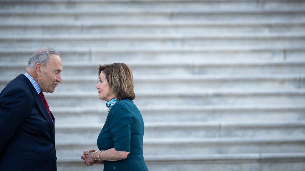 Senate Majority Leader Chuck Schumer talks with Speaker of the House Nancy Pelosi