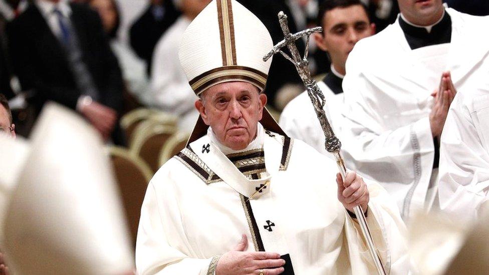 Pope Francis leaves after the Christmas Eve mass in St. Peter"s Basilica at the Vatican, December 24, 2019