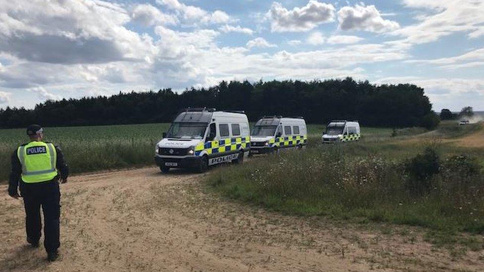 Police vans at rave site