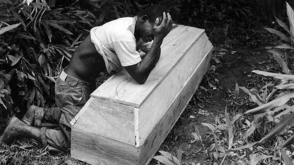 Aniceto takes the body of his wife Ubertina through the jungle in the Colombian region of El Choco