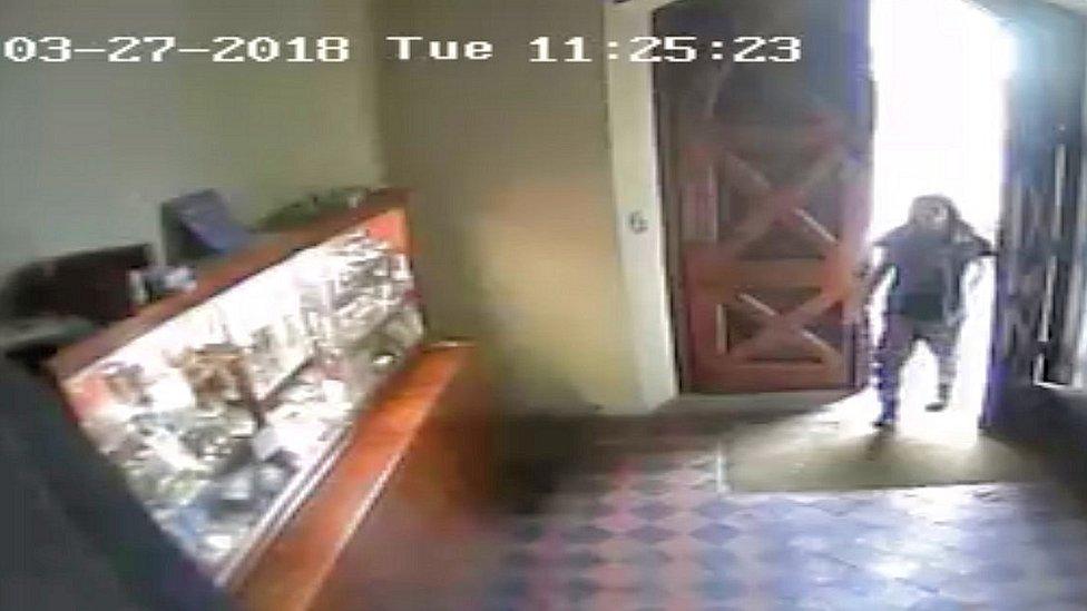 CCTV image of man at church doors