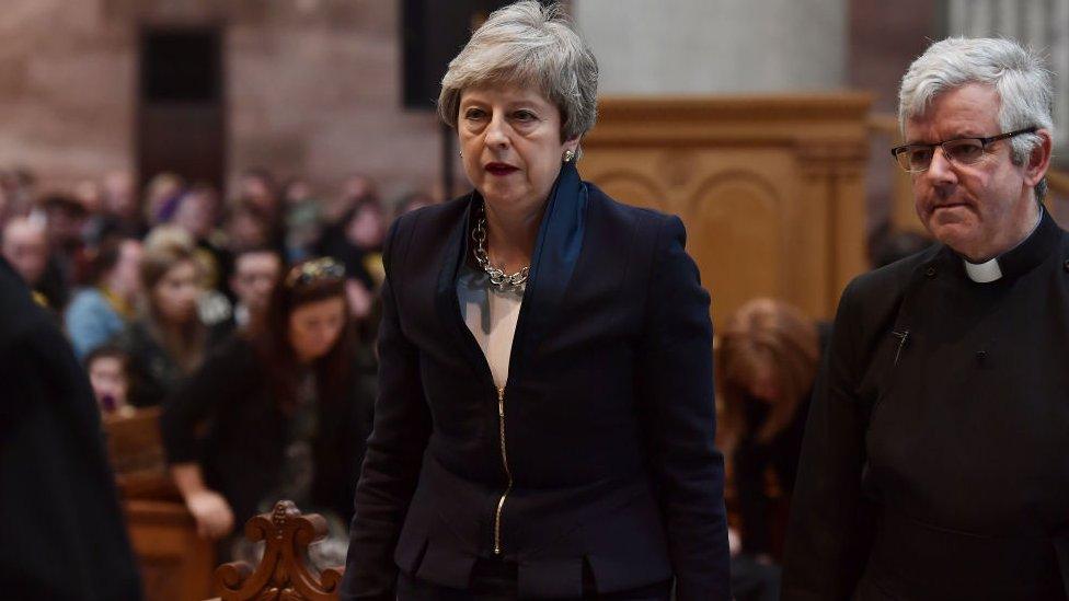 Prime Minister Theresa May arrives for the funeral service.