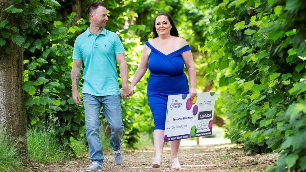 Sammantha Young and husband Paul with lottery cheque